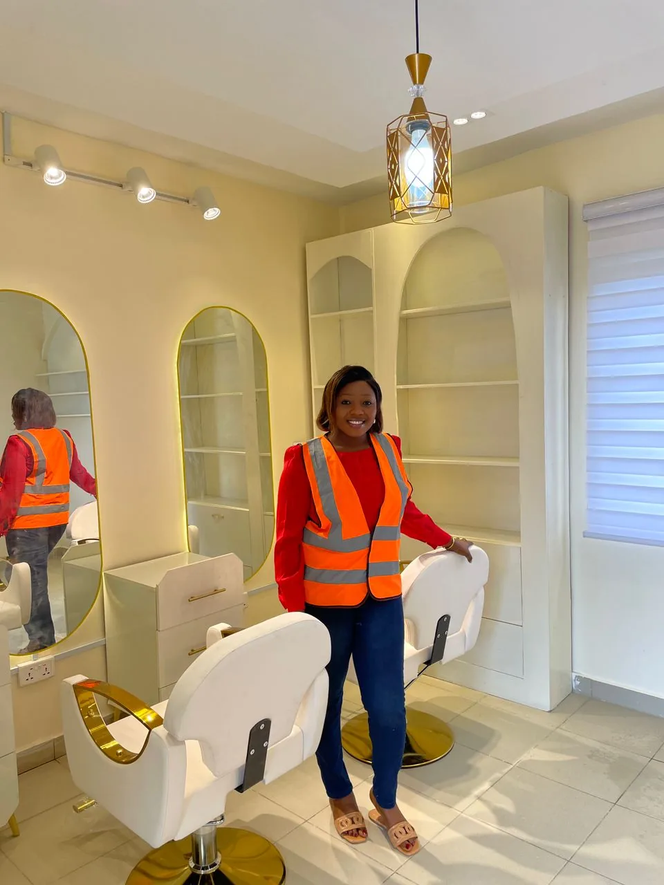 Custom arched shelving and back-lit mirrors in House of Keeks
