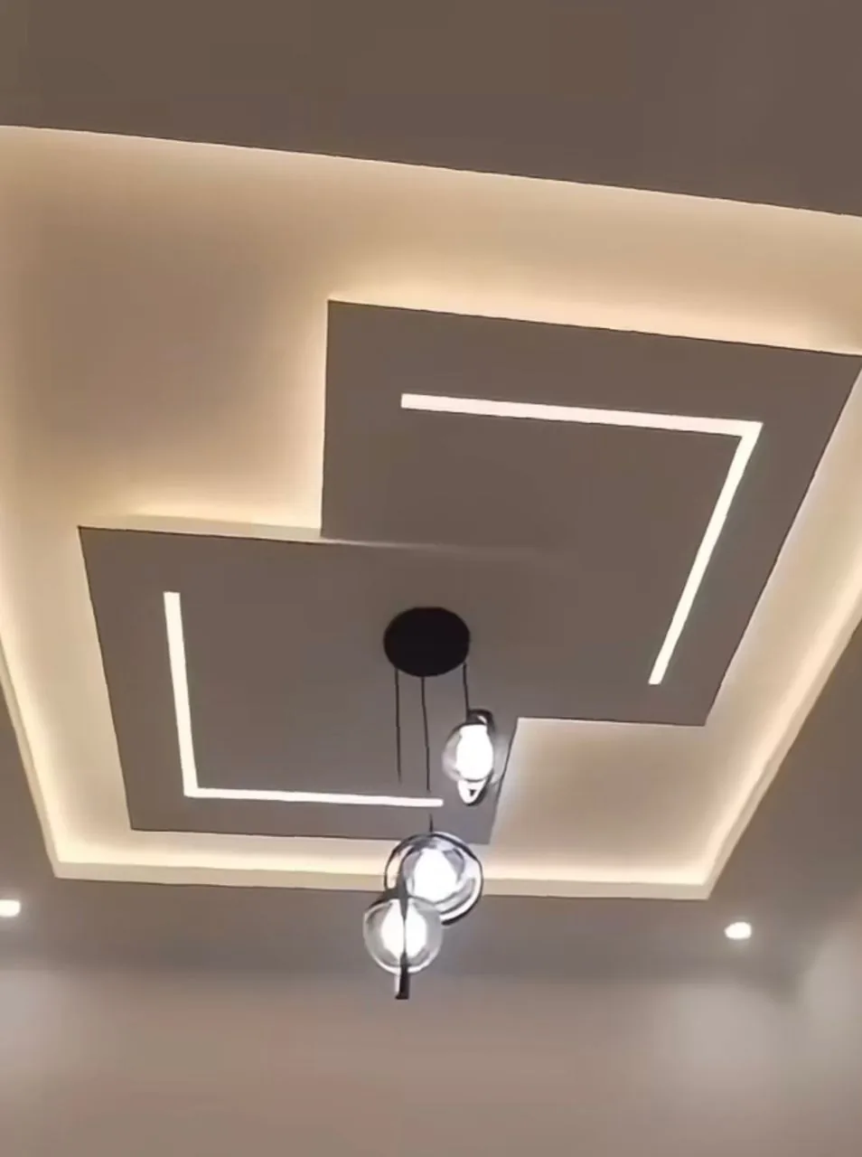 Detail of the golden pendant lighting and warm ambient glow